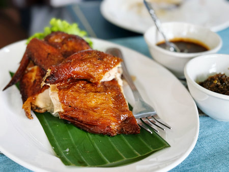 Fried chicken on banana leaf,Thai style food in Thailand.の写真素材