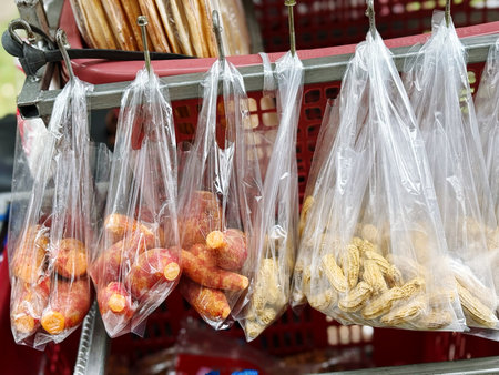 Tasty and healthy food in plastic bags for sale at farmers marketの写真素材