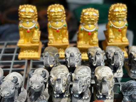 Statues of elephants for sale at a flea market in Chinaの写真素材