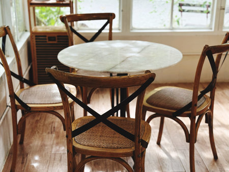 wooden chairs and table in the living room.