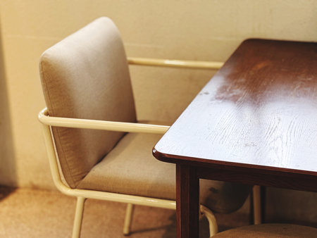 Wooden table and chair in coffee shop, vintage tone, stock photoの写真素材