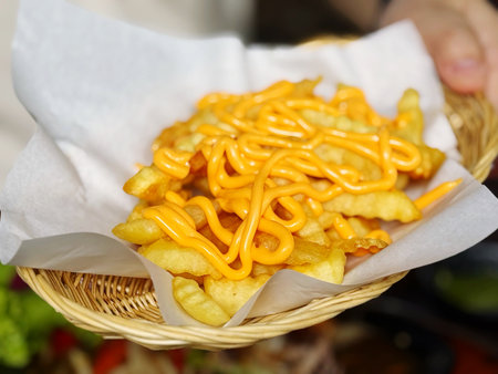 Close up of french fries in a basket on the street food marketの写真素材