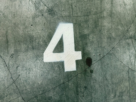 Number 4 on grunge cement wall. Texture and background for design.