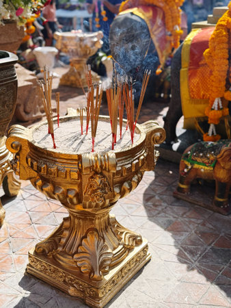 Incense sticks and incense burner in a Buddhist temple in Thailandの写真素材