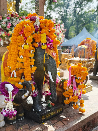 Elephant statue and flower garland in the temple, Thailand.の写真素材