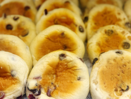 Close-up of a group of buns with raisins