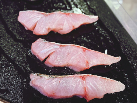 Tuna sashimi on black plate, japanese foodの写真素材