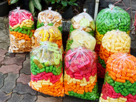 Colorful candies in plastic bags on the street in Thailand.の写真素材
