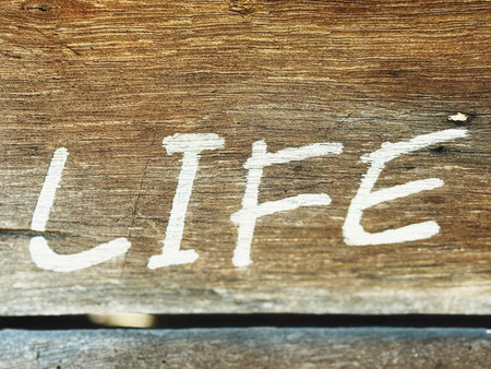 hand writing on wooden background with space for your text or imageの写真素材