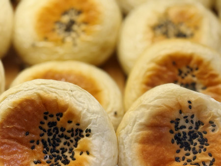 Close-up of chinese pastry with black sesame seeds.の写真素材