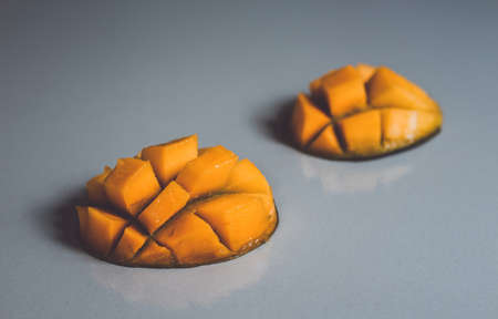 Sliced mango fruit on a white background. Fresh mango.の写真素材