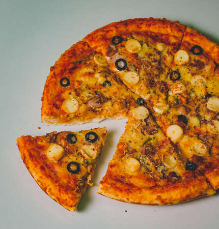 Pizza Margherita on white stone background