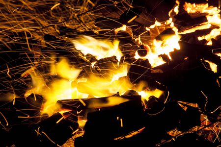 Hot sparking live-coals burning in a barbecueの写真素材