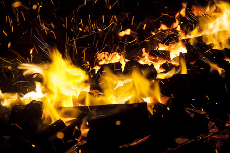 Hot sparking live-coals burning in a barbecueの写真素材