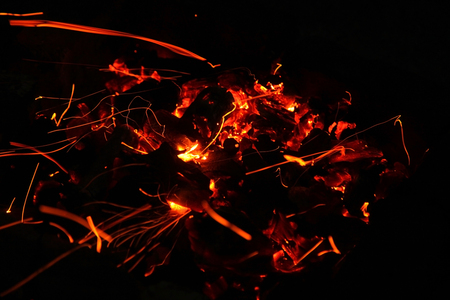 Hot sparking live-coals burning in a barbecue
