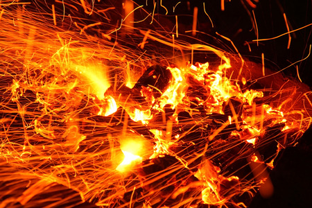 Hot sparking live-coals burning in a barbecueの写真素材