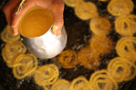 Delicious jalebi frying in oil panの写真素材