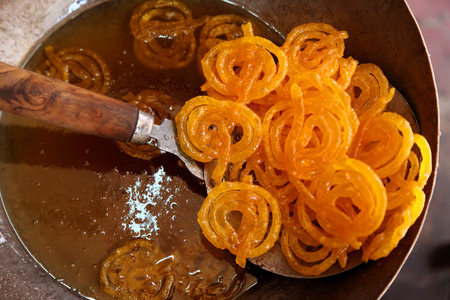 Delicious jalebi frying in oil panの写真素材