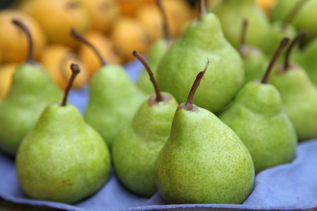 peer fruit in market stallの写真素材