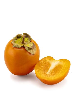 fresh ripe persimmons with leaf isolated on white background. full depth of fieldの写真素材