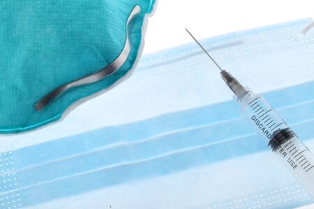 injection over a table with medicaments and coronavirus blood test. Vaccine concept.の写真素材