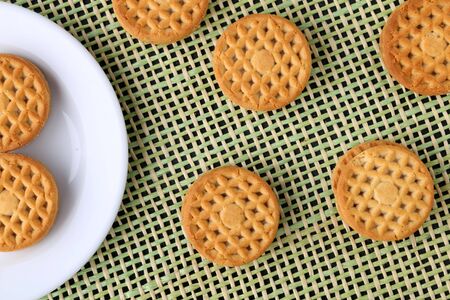 cookie close-up on a plate on a table. vertical view from aboveの写真素材