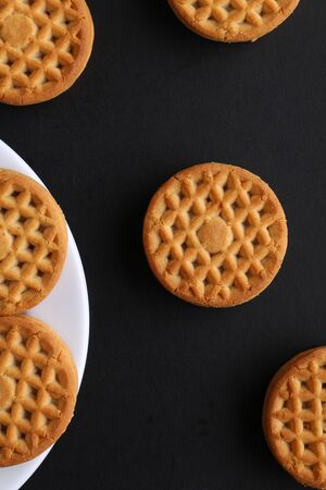 cookie close-up on a plate on a table. vertical view from aboveの写真素材