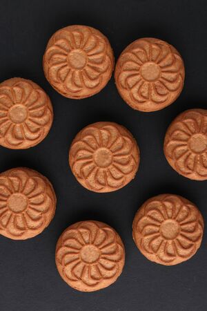 cookie close-up on a plate on a table. vertical view from aboveの写真素材