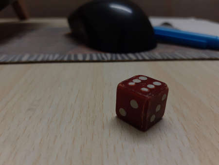 A close up of a dice on a table. High quality photoの写真素材