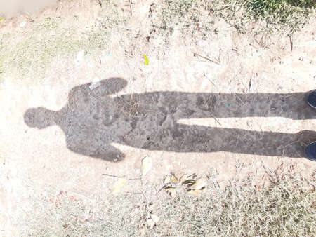 A man that is standing in the dirt. High quality photoの写真素材