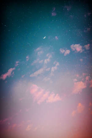 Night sky with stars and moon. Colorful sky with clouds.の写真素材