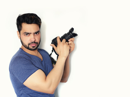 Young indian Photographer with cameraの写真素材