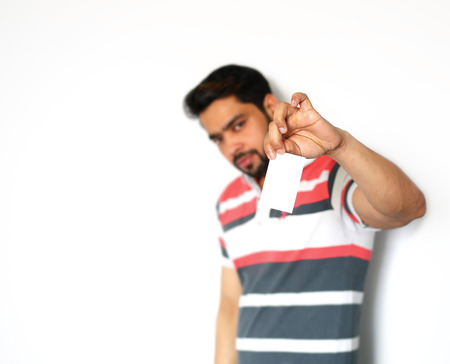 Men holding showing blank business card over white backgroundの写真素材