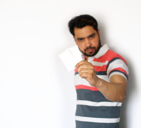 Men holding showing blank business card over white backgroundの写真素材