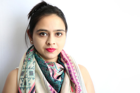 A portrait of a beautiful young indian woman against of white background