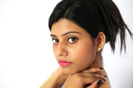 Portrait of stylish young indian girl on a white background