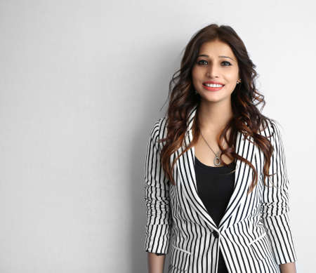 Business woman portrait, An Attractive beautiful happy young Indian businesswoman smiling on white...
