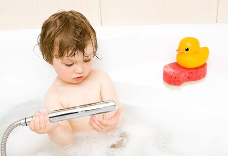 sweet toddler baby girl in bath