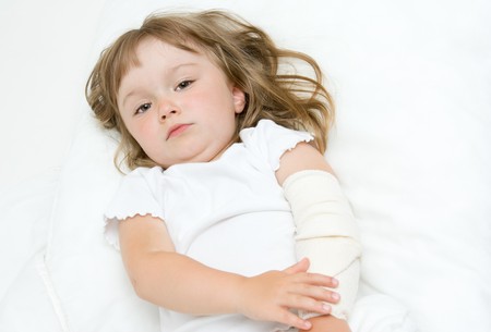 sick litttle girl  on bedの写真素材