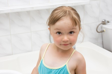 happy little girl in toiletの写真素材