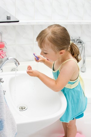 happy little girl in toiletの写真素材