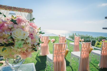 Flower decoration for Wedding ceremony in the day time with many chairs. vintage color toneの写真素材