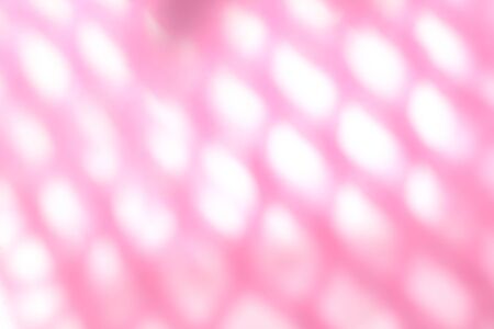 Macro closeup side of soft pink fruit net with light shine on, blurredの写真素材