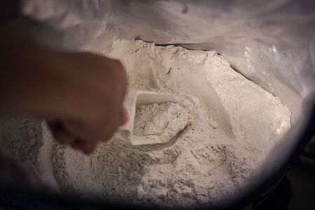 scoop whey protein inside whey bagの写真素材