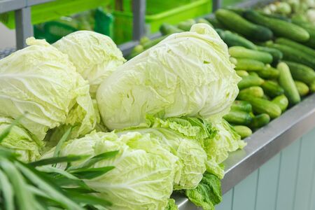 cabbage with other vegetable in front of shop at the marketの写真素材