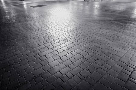 background of square tile on walkway in black and whiteの写真素材