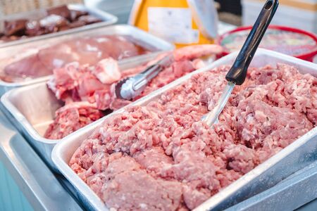 pork that fine chopped for cooking some special menu in tray for get with big spoon to scale the weight for sellの写真素材