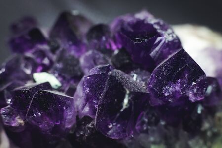 amethyst with light shine on, on black backgroundの写真素材