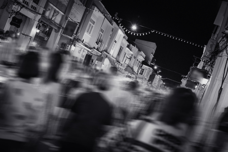 several people walking in the night market on old town road, motion blurredのeditorial素材