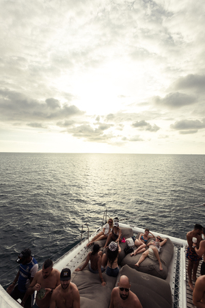 Phuket, Thailand - 17 January 2018: luxury boat party with many foreign people relax in front of the...
